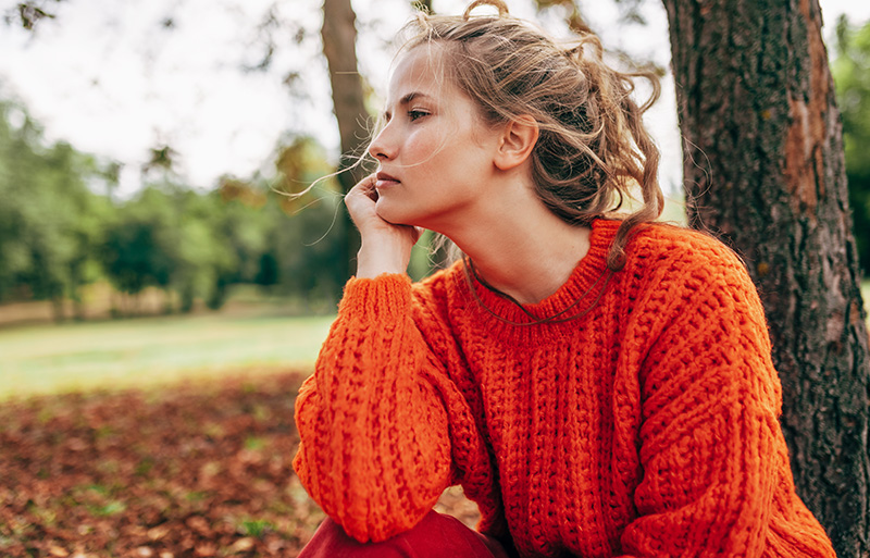 woman looking off to the side outside